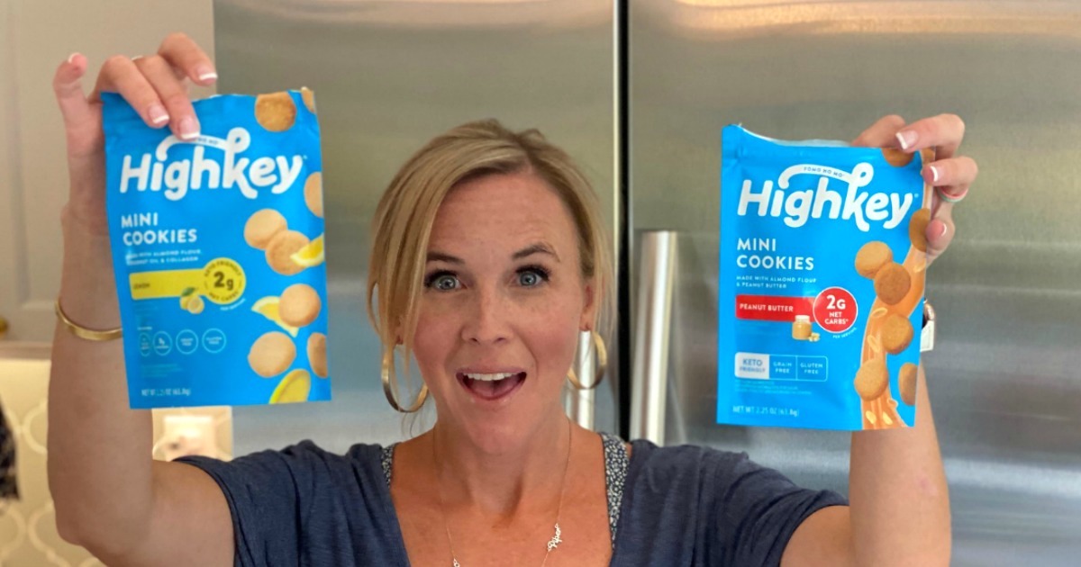 woman holding 2 bags of high key cookies