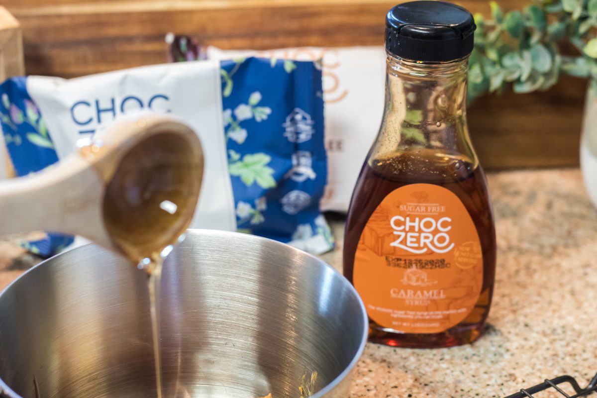 pouring caramel syrup into pan
