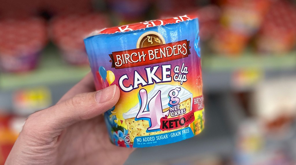 hand holding birch bender keto cup birthday cake flavor