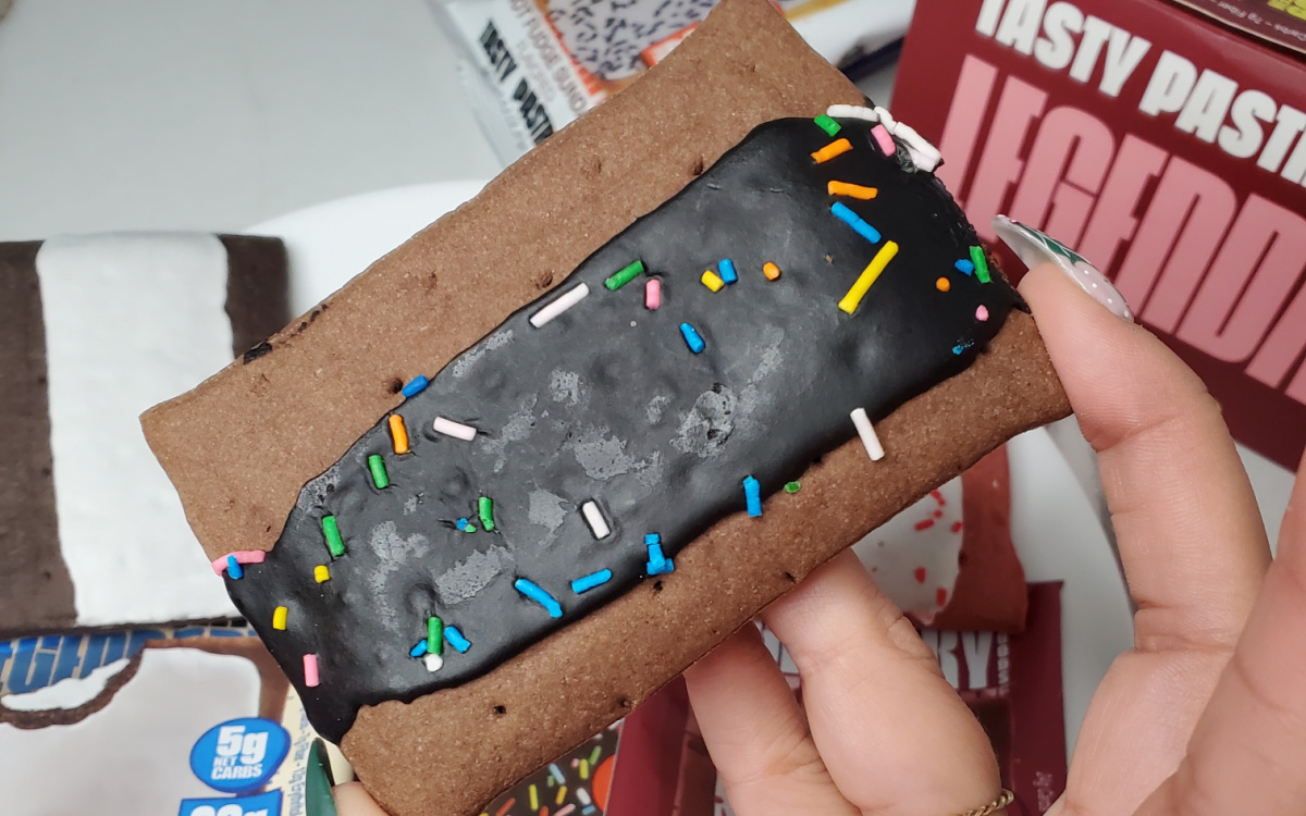 chocolate frosted keto pop tart in hand