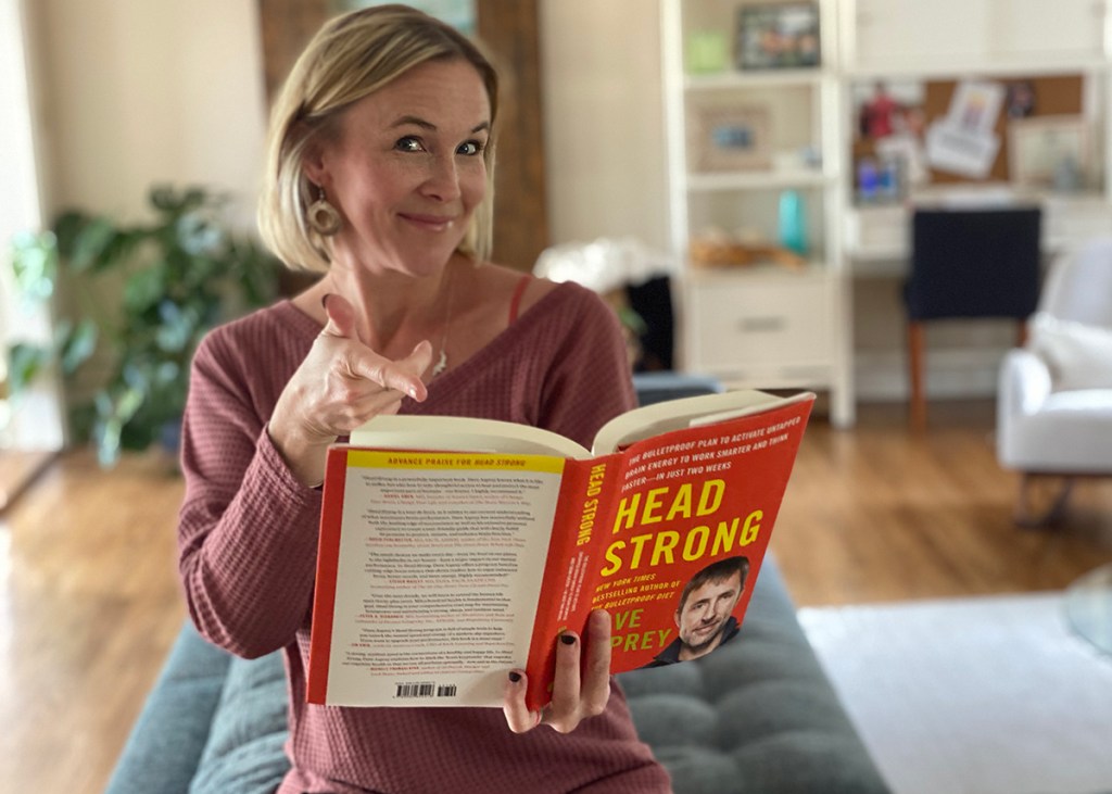 women with head strong book opened up