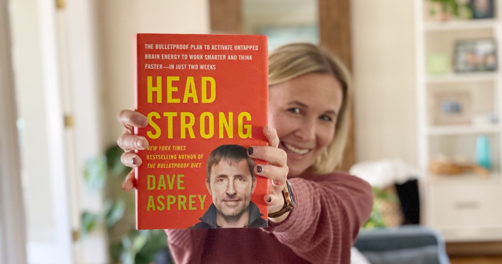 woman holding up head strong by dave asprey