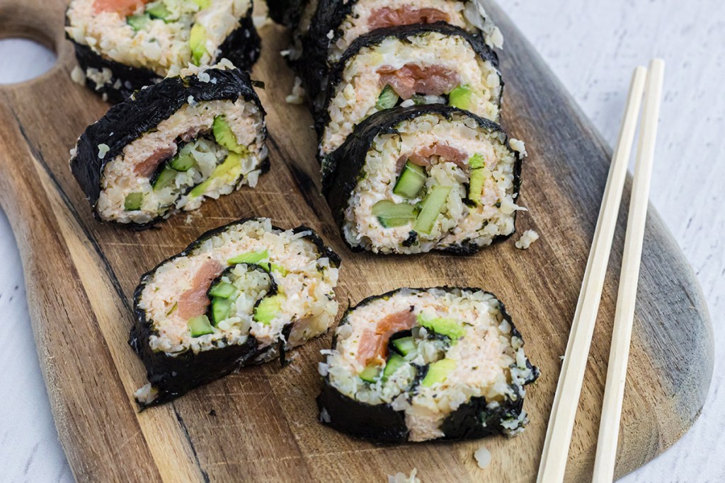 keto sushi roll pieces on cutting board