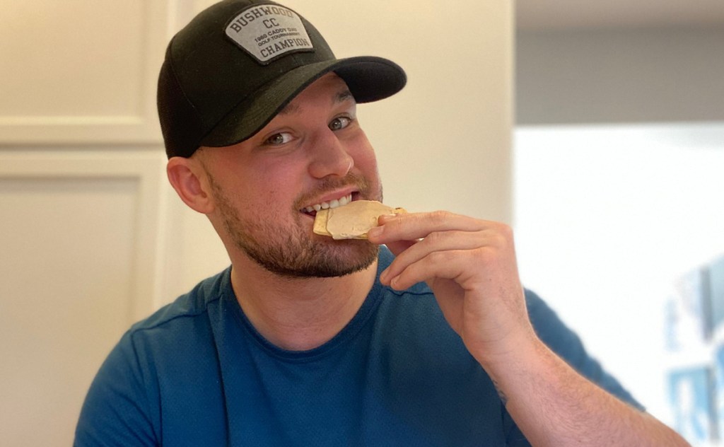 man eating tasty pastry