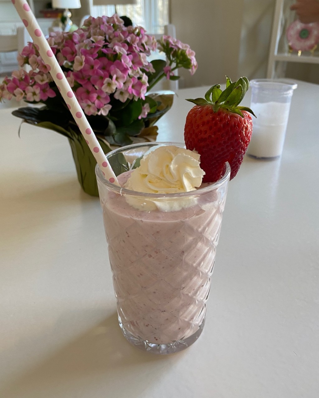 strawberry milkshake on table