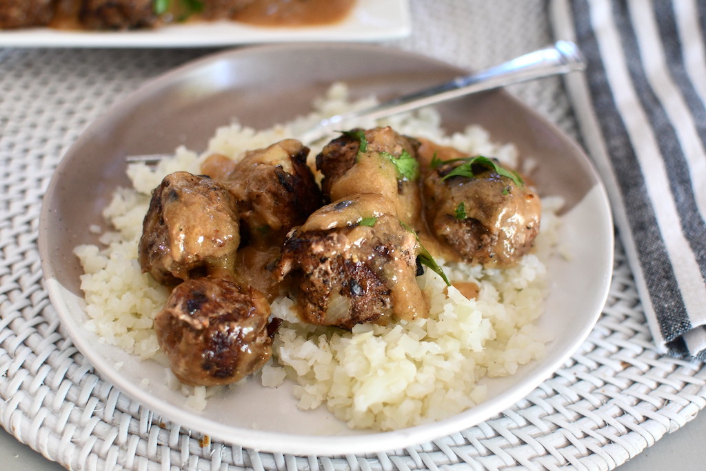 Swedish keto meatballs on plate with cauliflower rice 