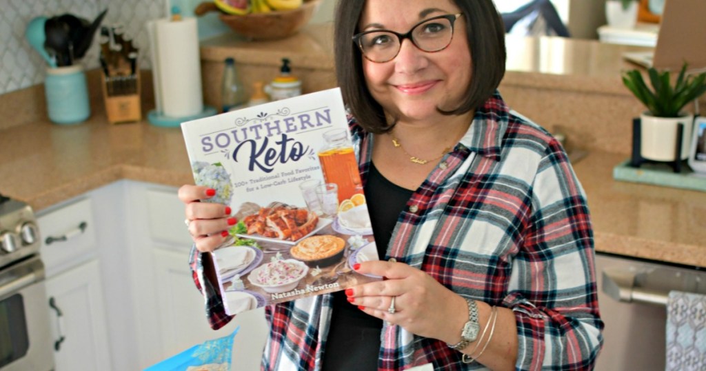 woman holding Southern keto cookbook