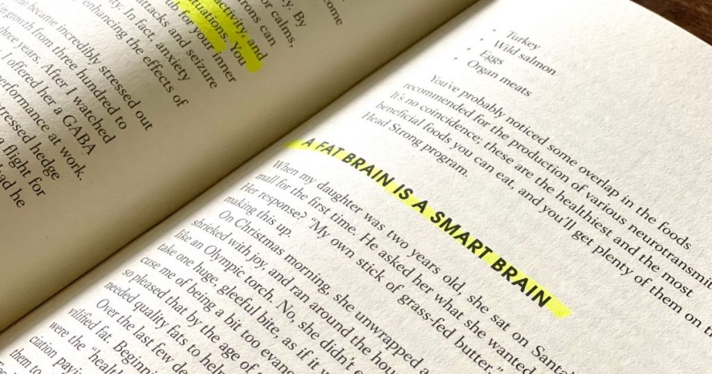 Head Strong book open to a page showing the text "A fat brain is a smart brain"