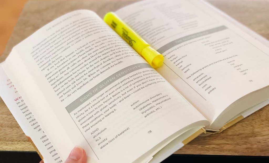 pages of book and yellow highlighter laying on top