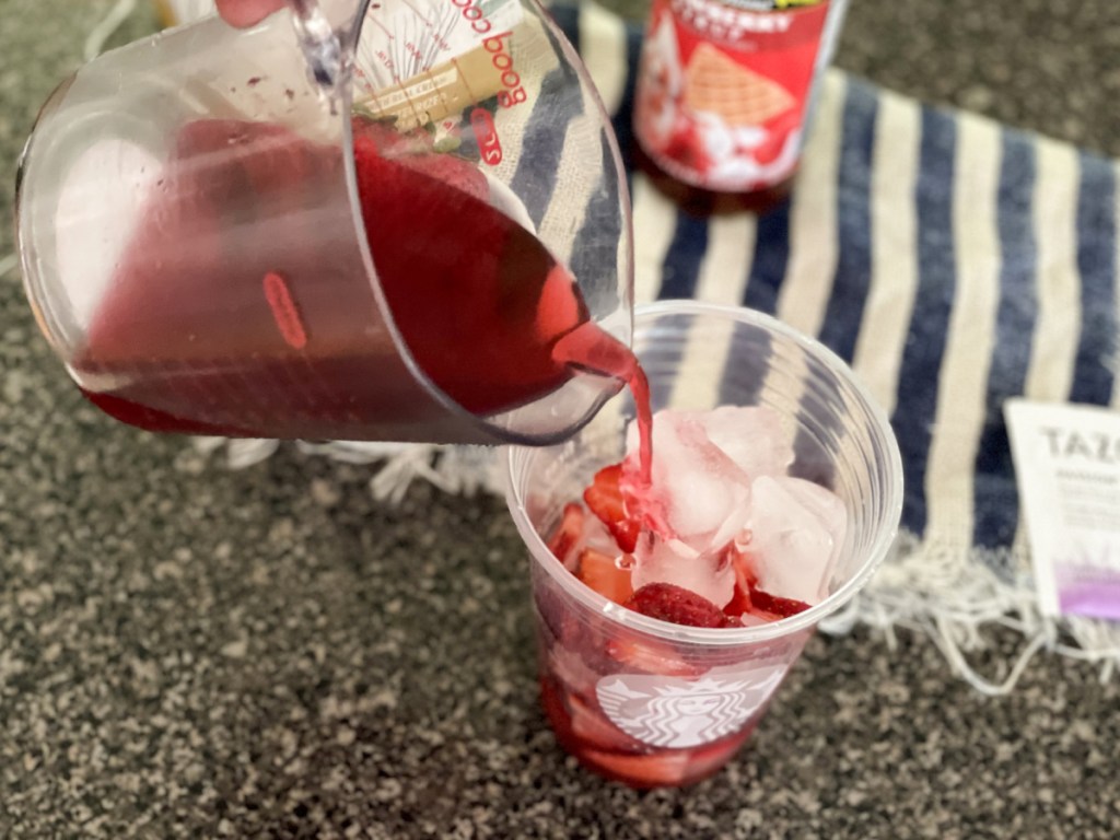 pouring passion tea into a glass