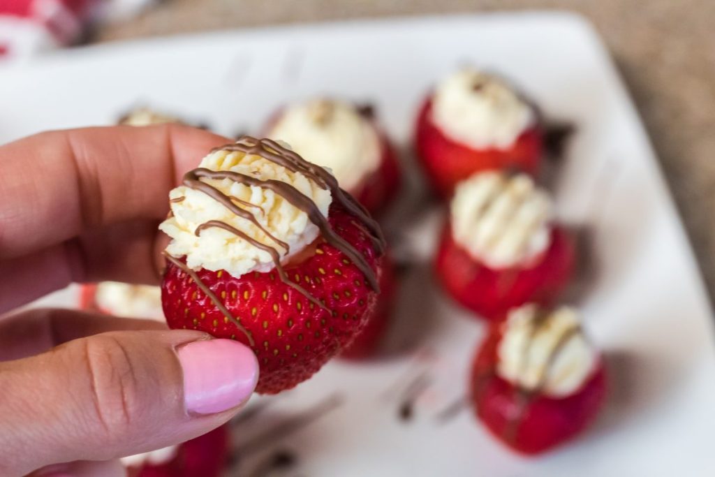 woman holding berry