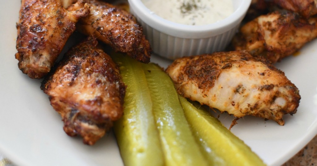 keto dill pickle chicken wings on plate with ranch dip