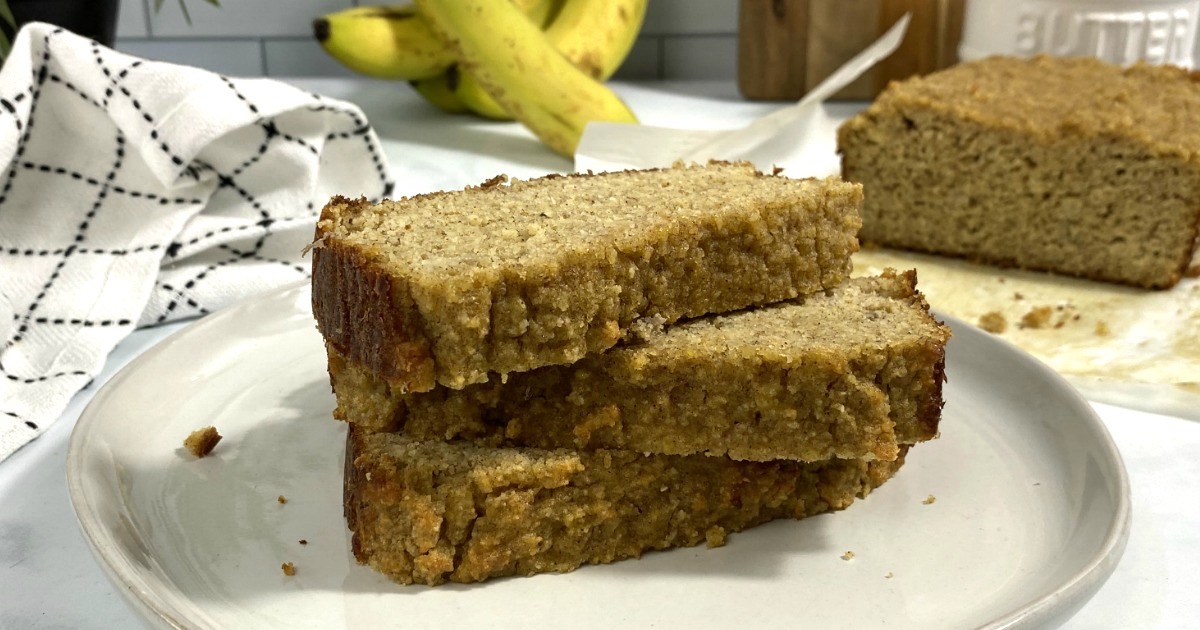 keto banana bread slices stacked on plate 