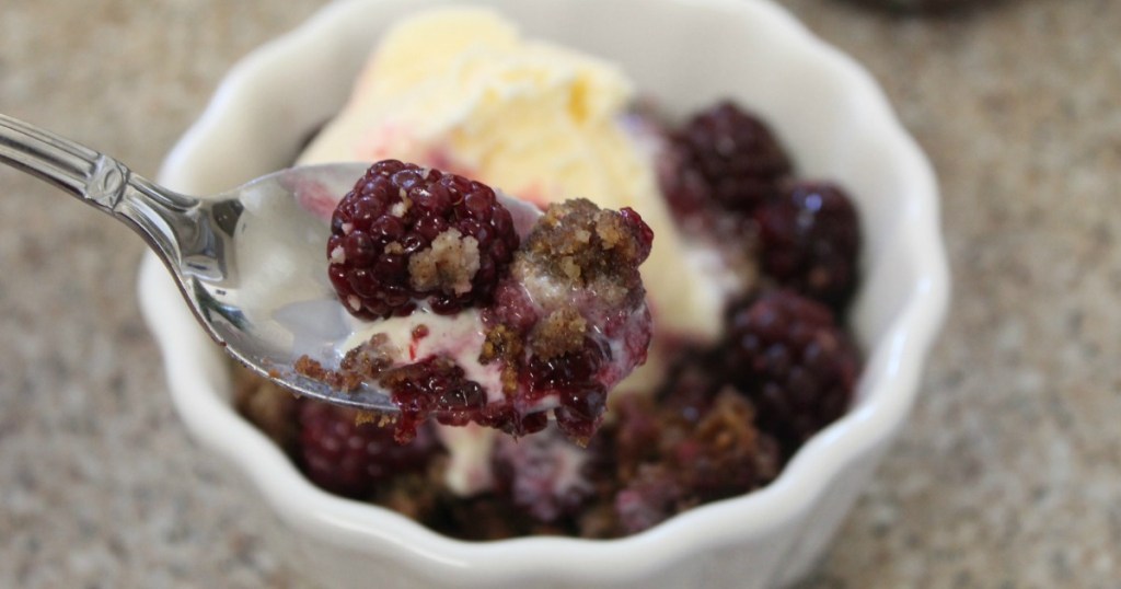 keto berry cobbler with ice cream and spoon