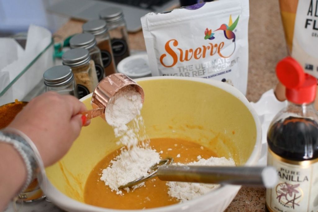 pouring zero-sugar sweetener into a bowl