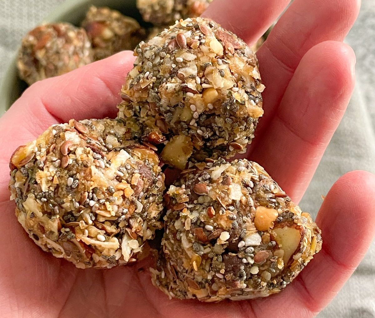 hand holding keto protein balls, a no bake recipe