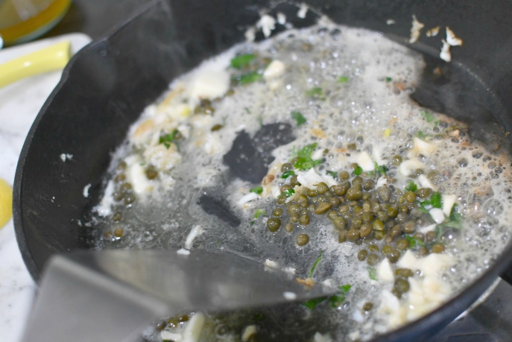 adding capers to the skillet