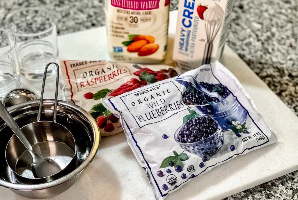 bags of frozen berries on marble counter top