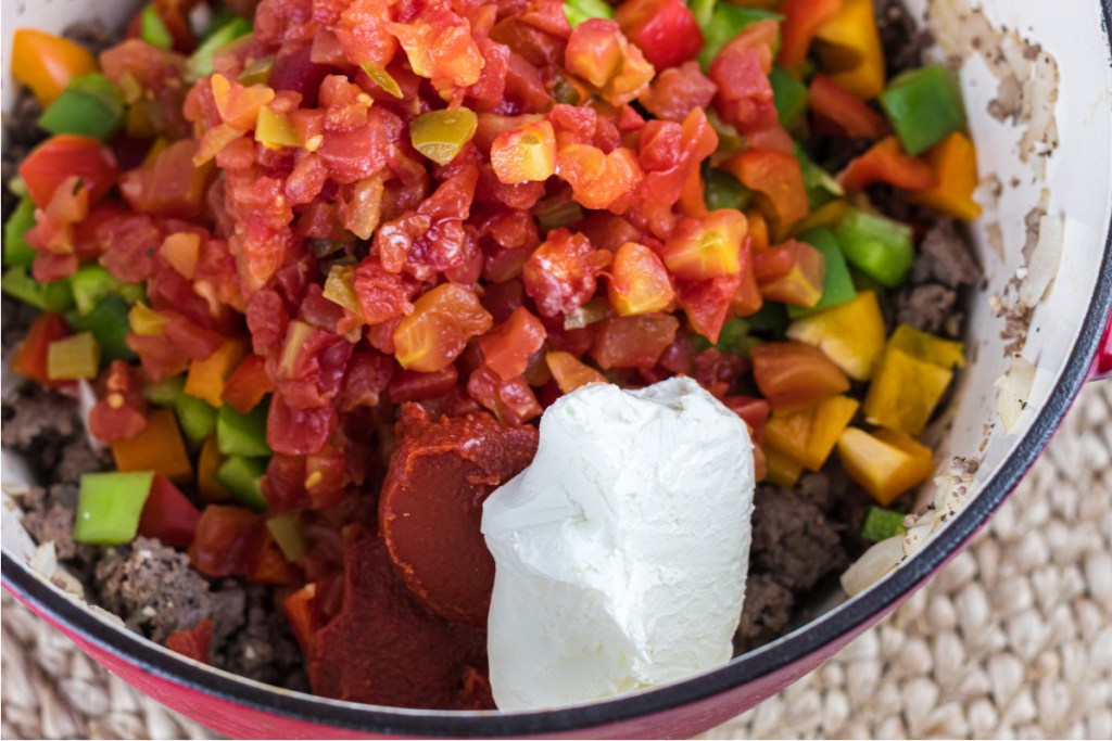 tomatoes, peppers, and sour cream in dutch oven