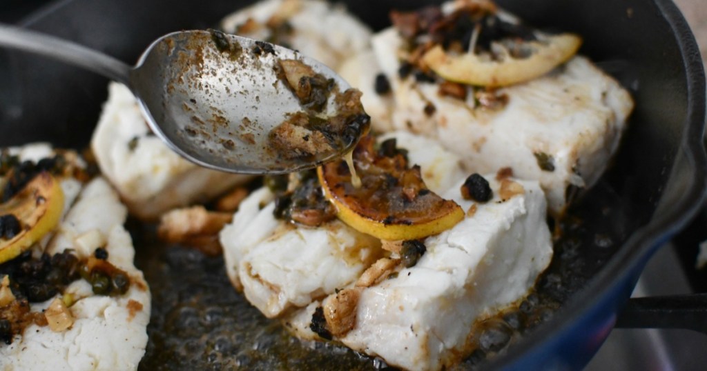 pouring butter on the halibut