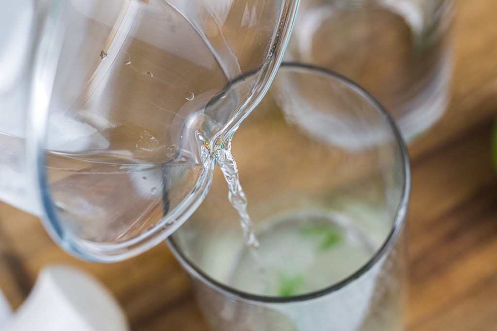 pouring in rum to glass