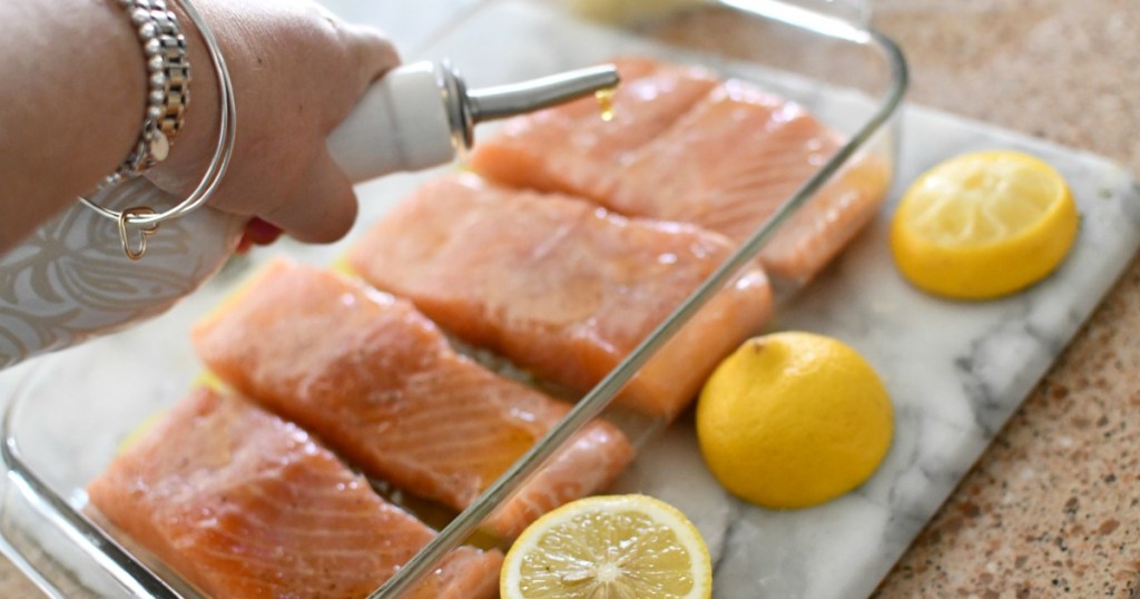 drizzling olive oil over salmon