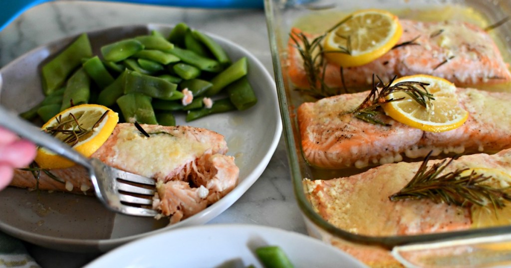 plated salmon with snap peas and additional salmon filets