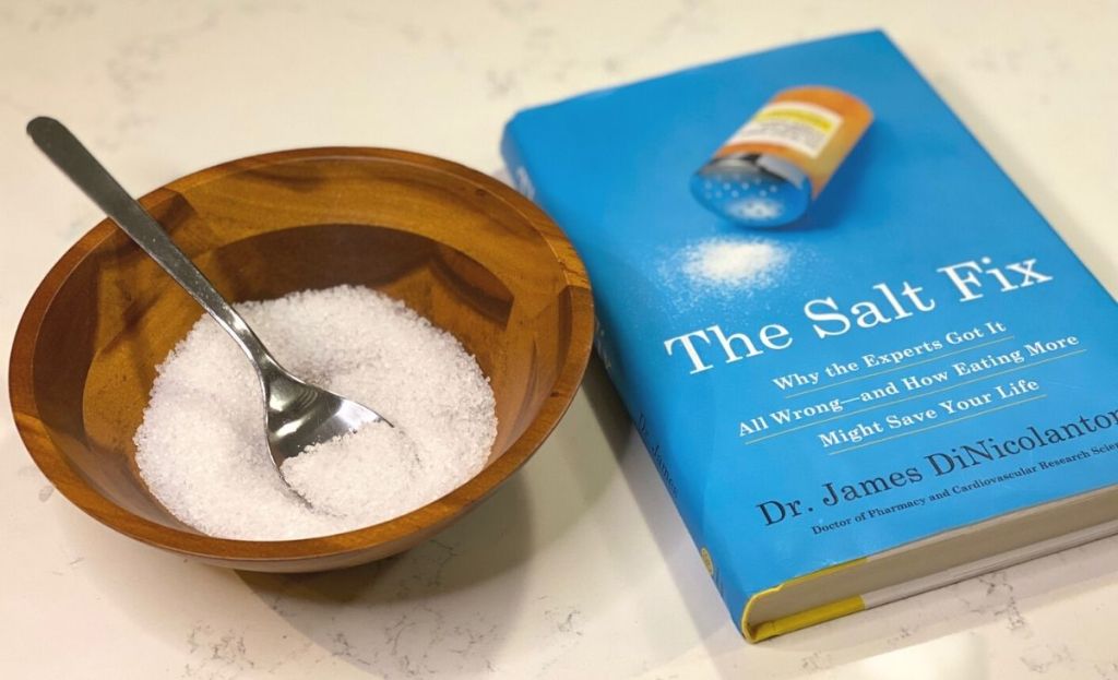 The Salt Fix book next to a bowl of salt