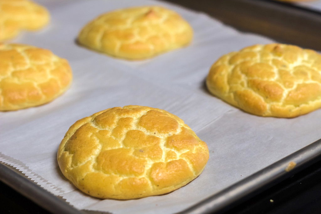 keto cloud bread on parchment lined baking sheet 