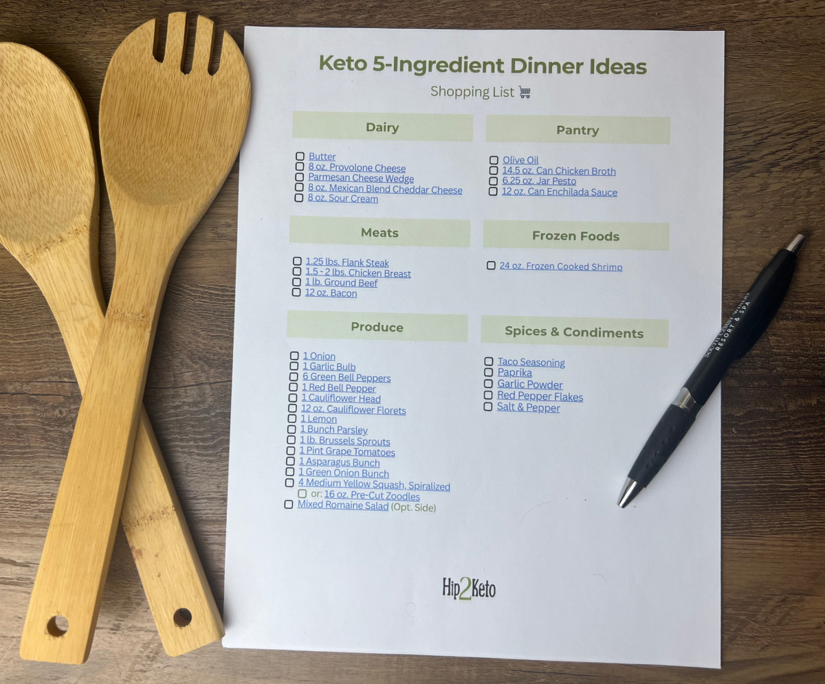 Keto 5-ingredient meals free printable checklist on a counter with utensils and a pen