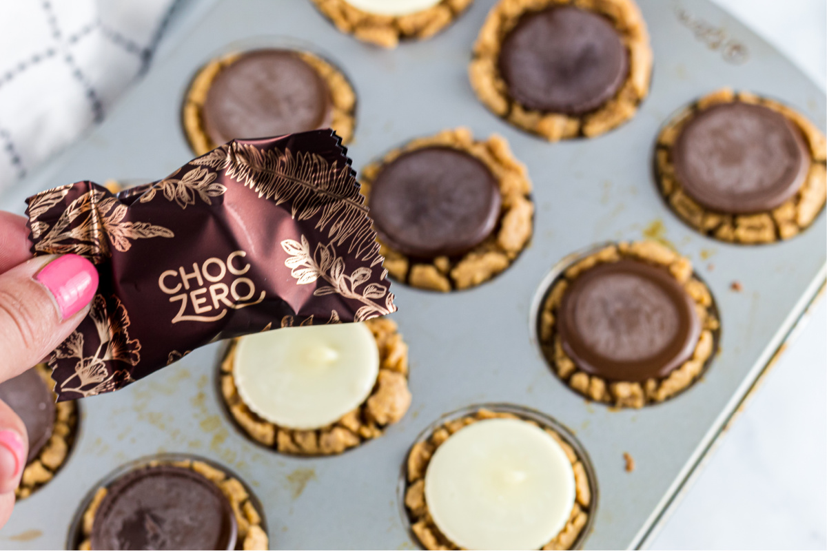 girl holding a ChocZero peanut butter cup