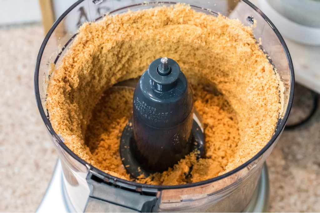 grinding peanuts in a food processor