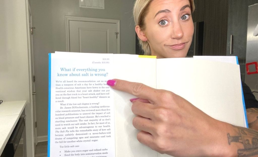A woman pointing to text in a book