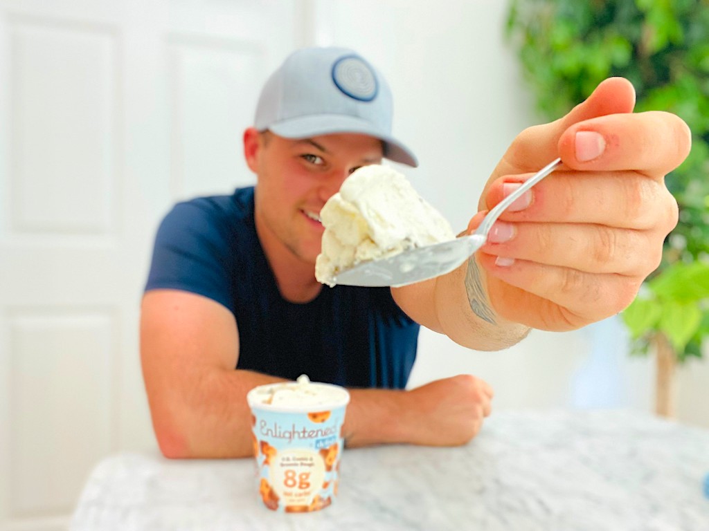 man holding Enlightened ice cream on spoon