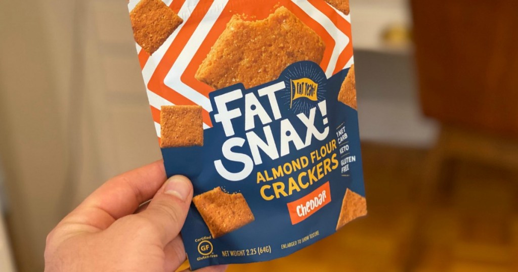 holding bag of Fat Snax crackers