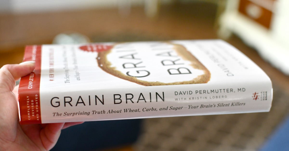 holding a copy of Grain Brain