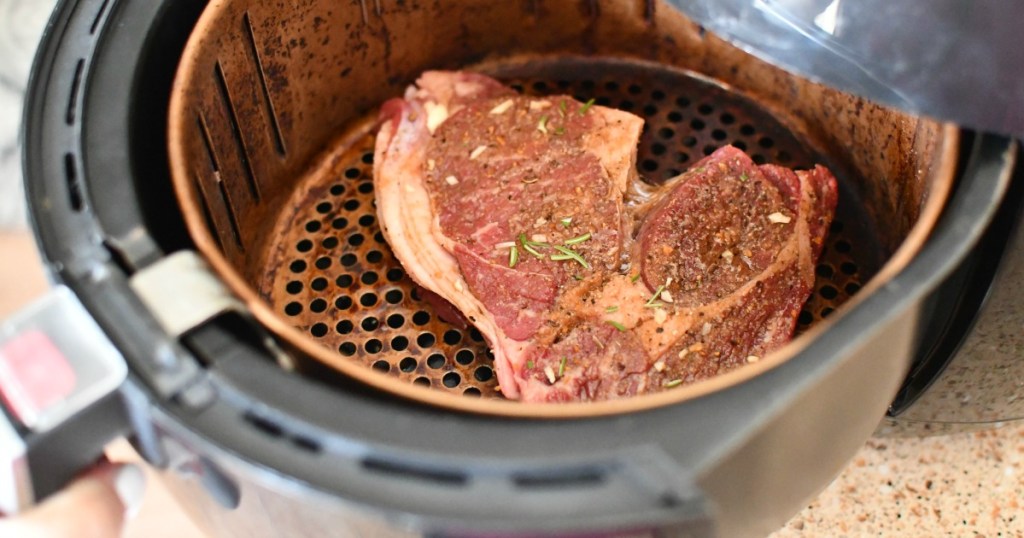 raw steak inside an air fryer 