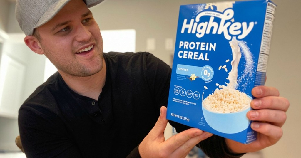 man holding HighKey keto protein cereal box