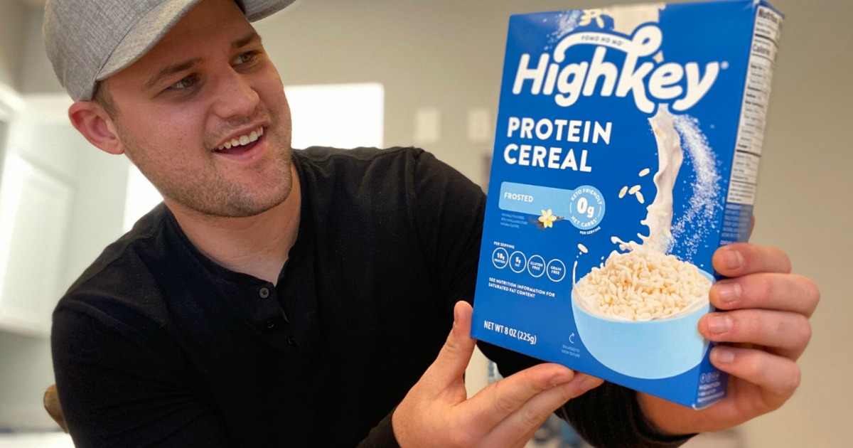 man holding box of HighKey cereal