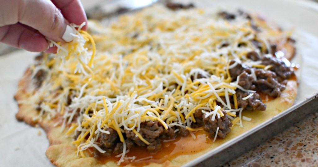 melting cheese on keto taco pizza