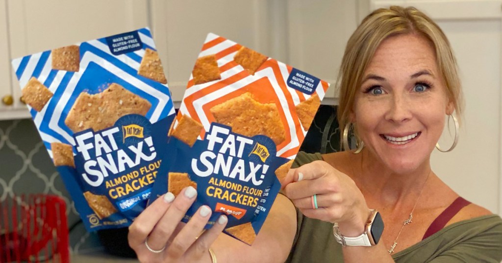 woman holding fat snax crackers