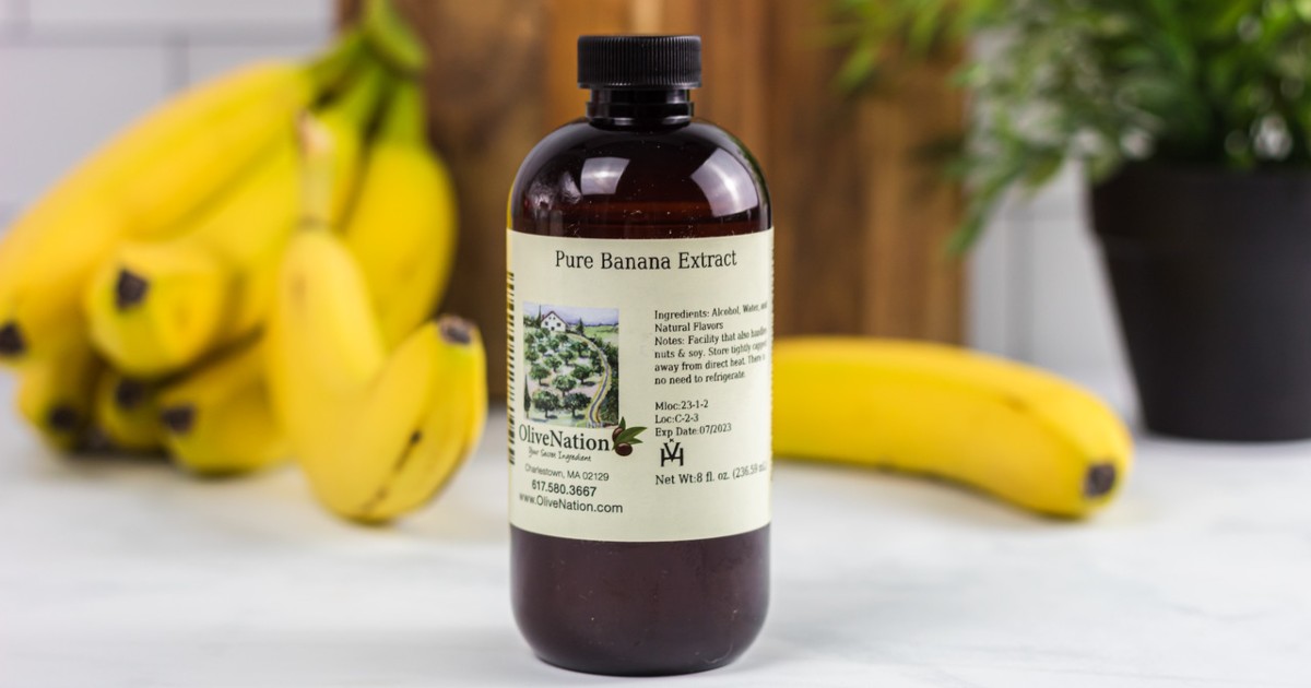 bottle of banana extract next to bananas