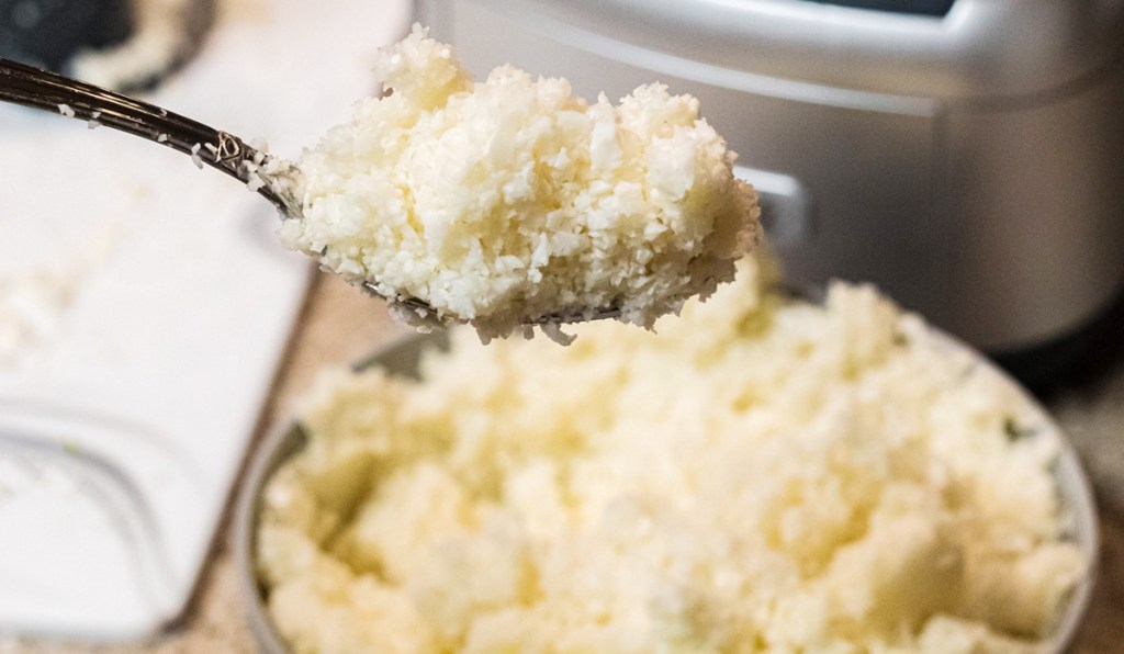 cauliflower rice on a spoon