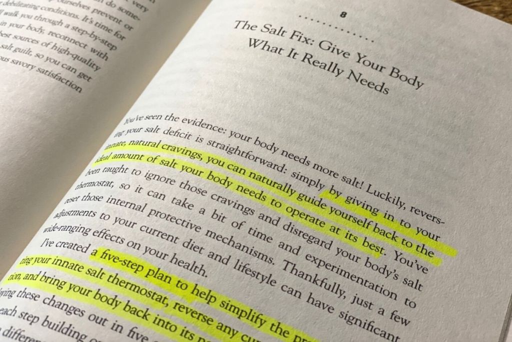 A book open to a page with highlighted text