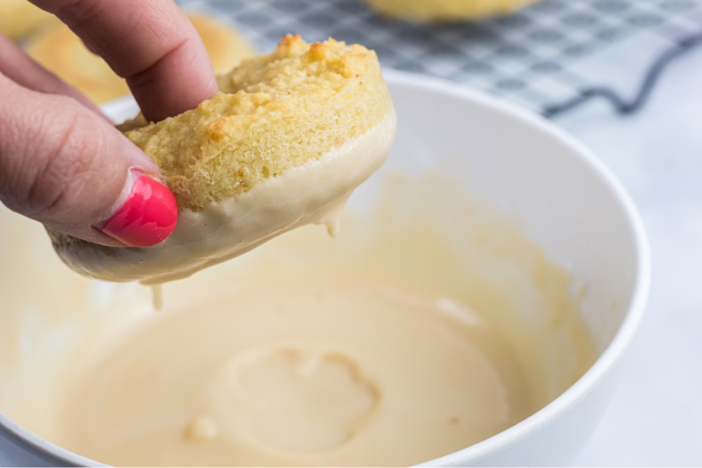 dipping donuts into icing