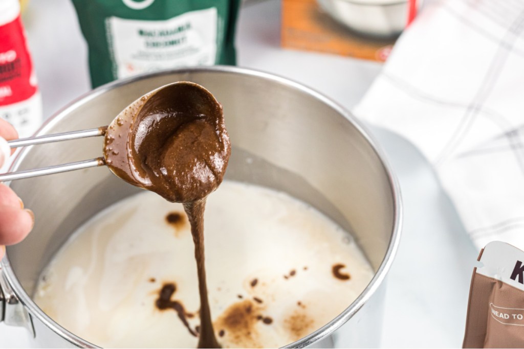 Pouring nut butter in saucepan