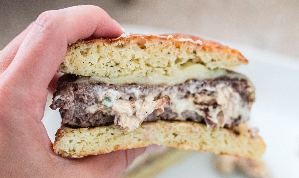 hand holding keto stuffed burger