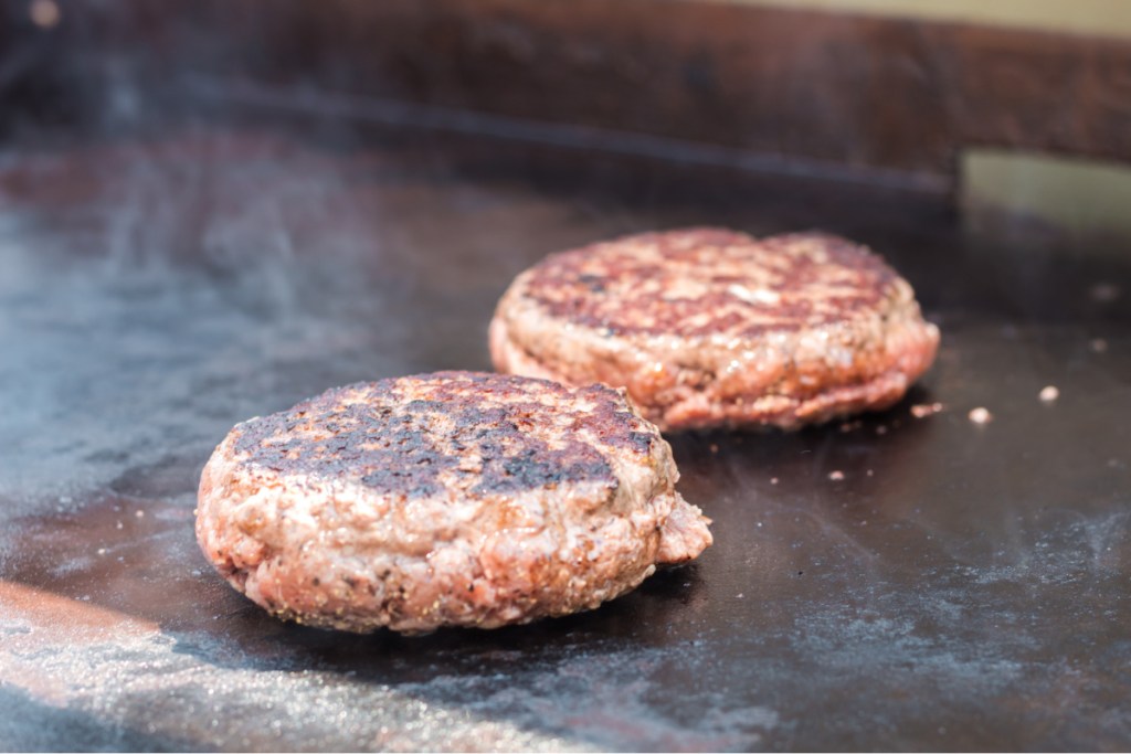 stuffed burgers on a griddle