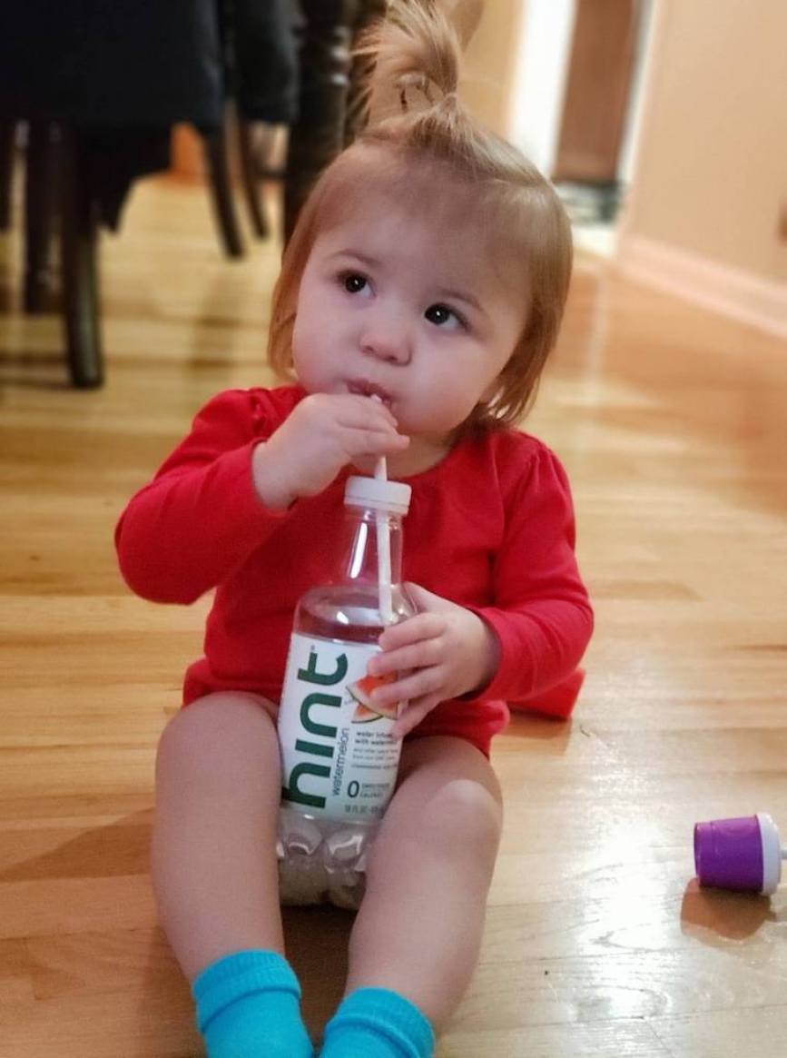 toddler drinking hint water with straw 
