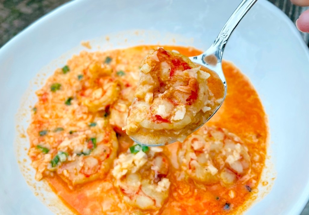 close up of spoon with shrimp soup